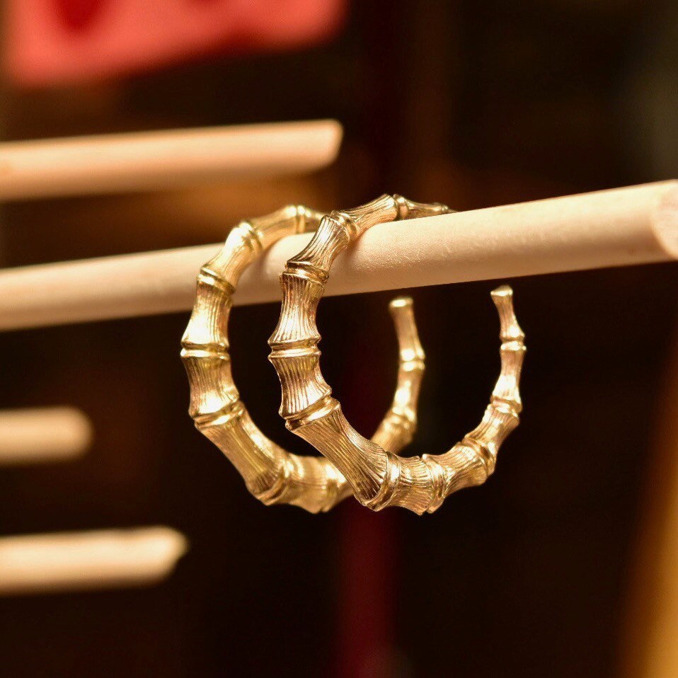 14K yellow gold bamboo hoop earrings, 35mm vintage statement stud hoops, close-up view