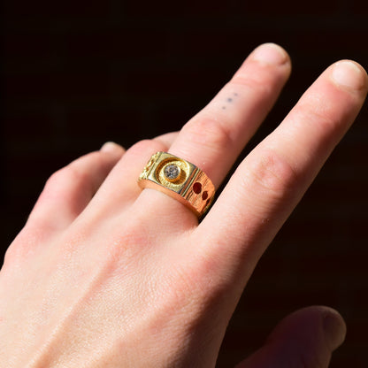 Vintage modernist 18K gold electroplated diamond signet ring with chunky textured band and circle cutout design, shown on a hand against a dark background, size 9 US.