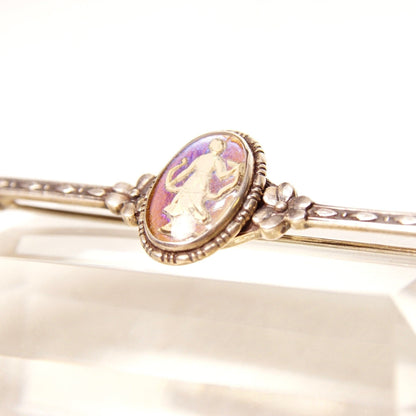 Antique Art Deco sterling silver bar pin from England featuring a small oval sulphide cameo with a colorful butterfly wing design, intricate floral and engraved accents, measuring 1 3/8 inches long.