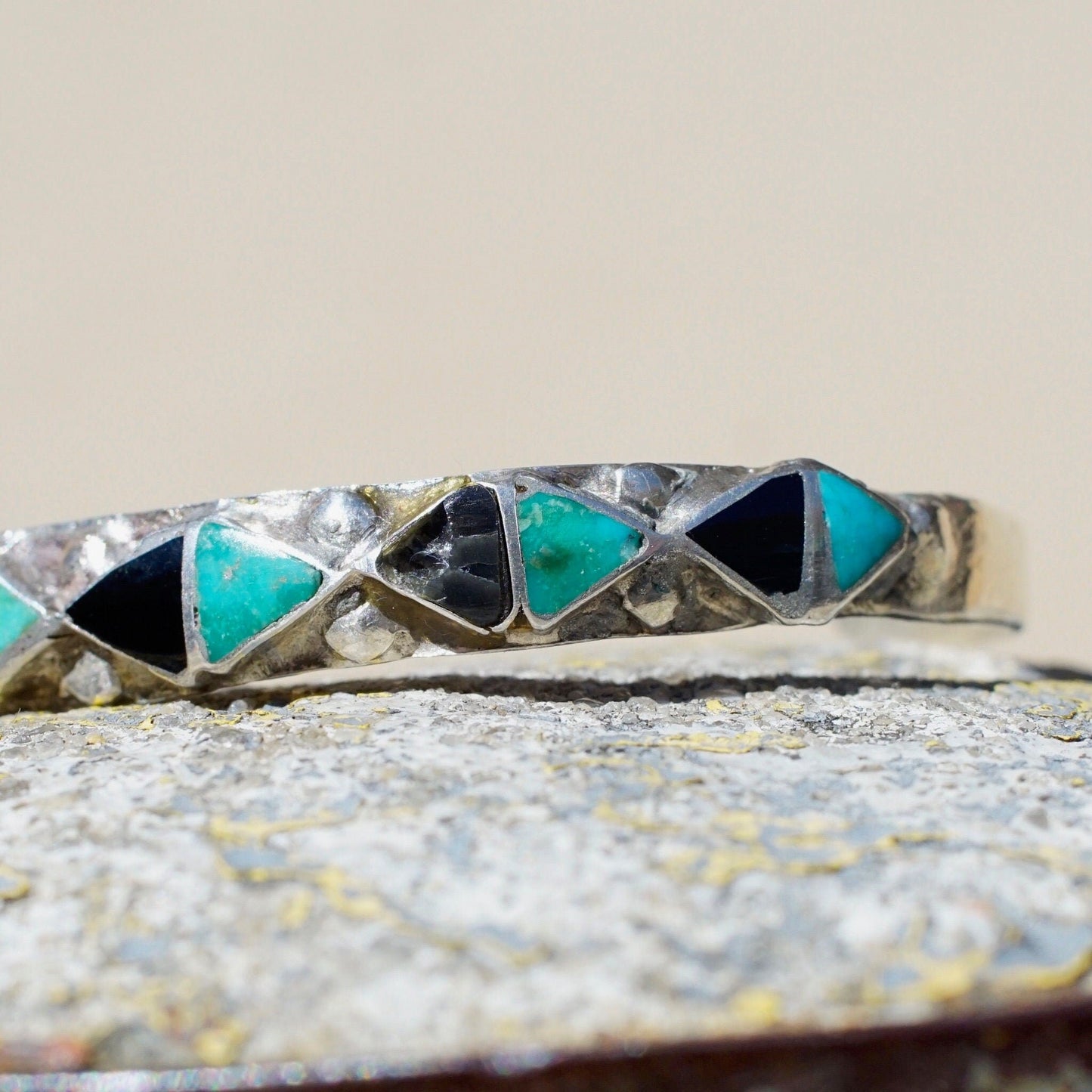 Vintage 70's Zuni silver cuff bracelet with inlaid turquoise and onyx triangle pattern, petite size, 4 3/4 inches long, Native American jewelry design.