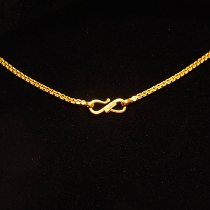 Vintage 22K yellow gold Bismark chain necklace featuring a flat, minimalist design. This delicate gold choker, crafted in India by KDM, measures 2mm wide and 16 1/4 inches long.