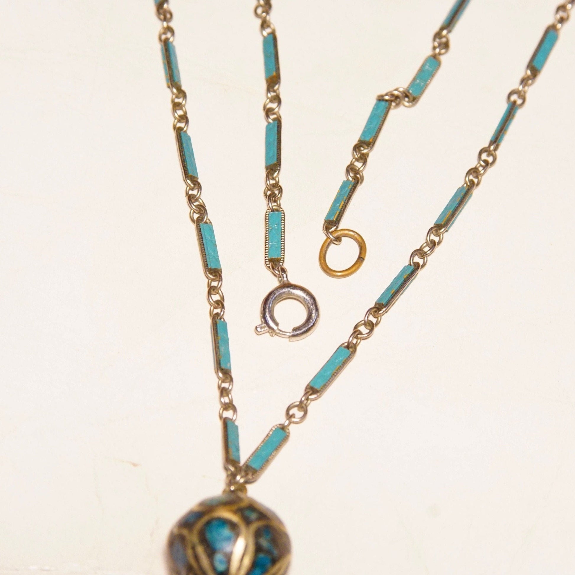 Vintage Indian mosaic turquoise brass inlay bauble pendant necklace with two-bead drop pendant on blue enamel silver link chain, 18 inches long.