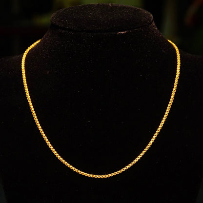 Vintage 22K yellow gold Bombay Bismark chain necklace with flat 2mm fence chain links, made in India by KDM, measuring 16.25 inches long, displayed on dark background.