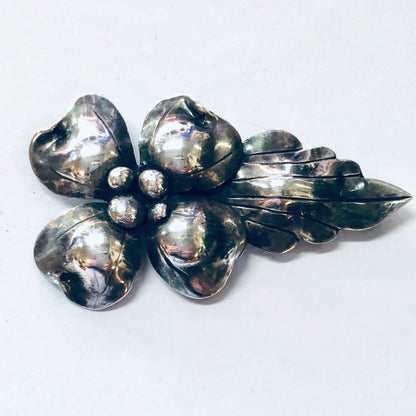 Vintage silver flower brooch pin with pearl accents, likely from John Wanamaker jewelry collection, displayed on white background