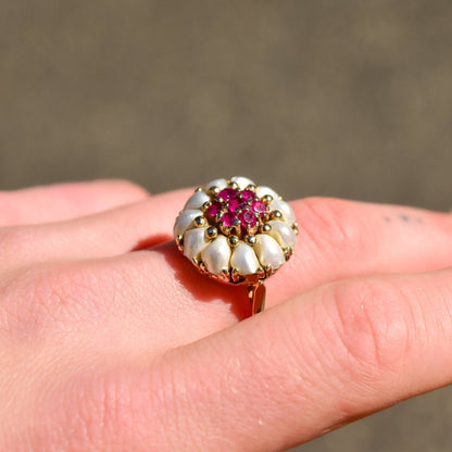 14K yellow gold pearl and ruby dome cluster cocktail ring on finger, estate jewelry, size 9 US