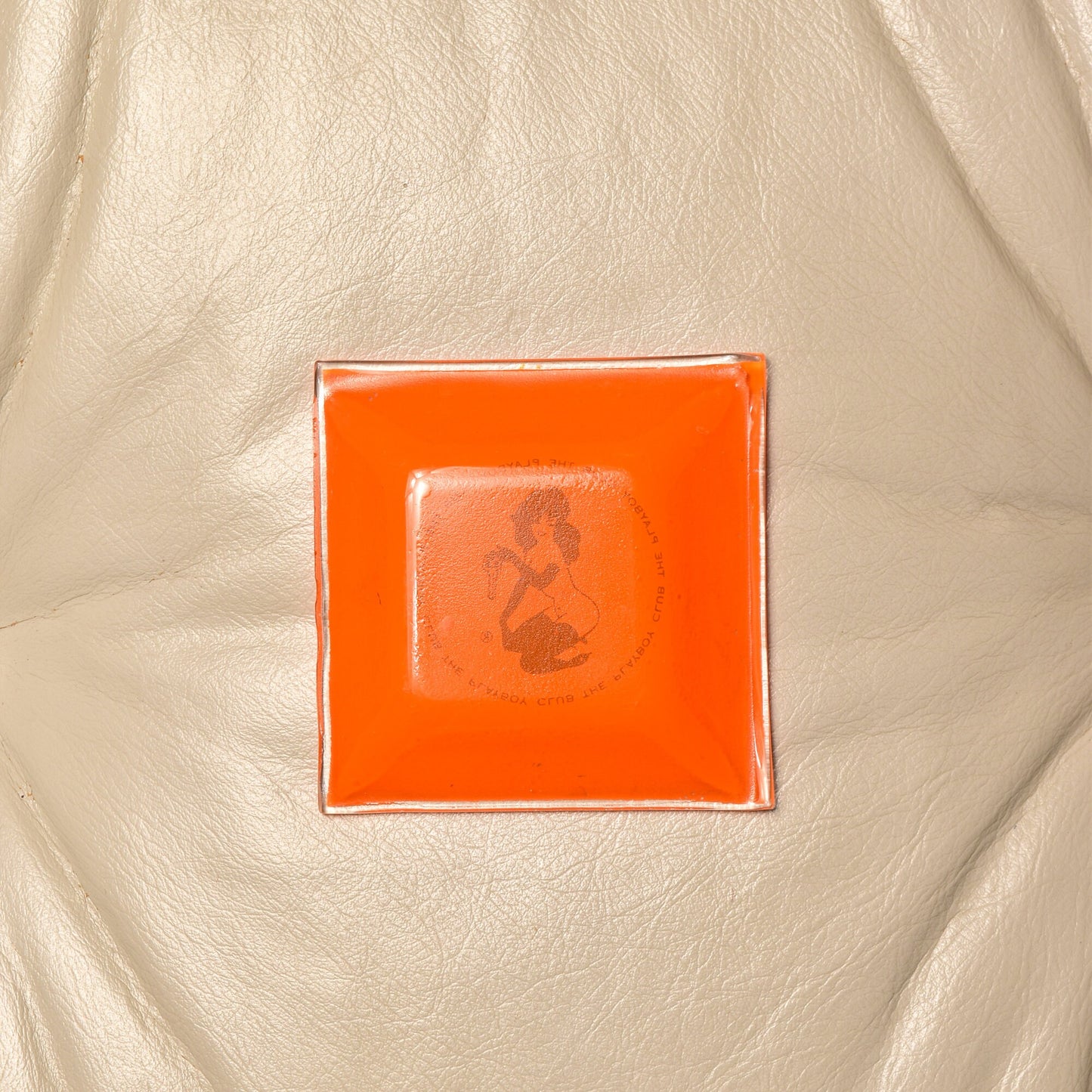 Vintage 1960s Playboy Club orange glass ashtray with Leroy Neiman Femlin etching design, small trinket dish, 4.75 inches square, collectible retro smoking accessory