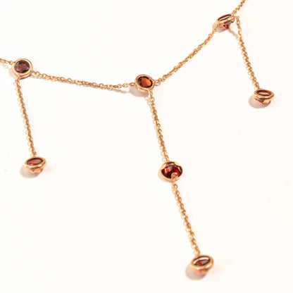 14K gold garnet station tassel choker necklace with minimalist bezel-set drops on a delicate chain, 16 inches long