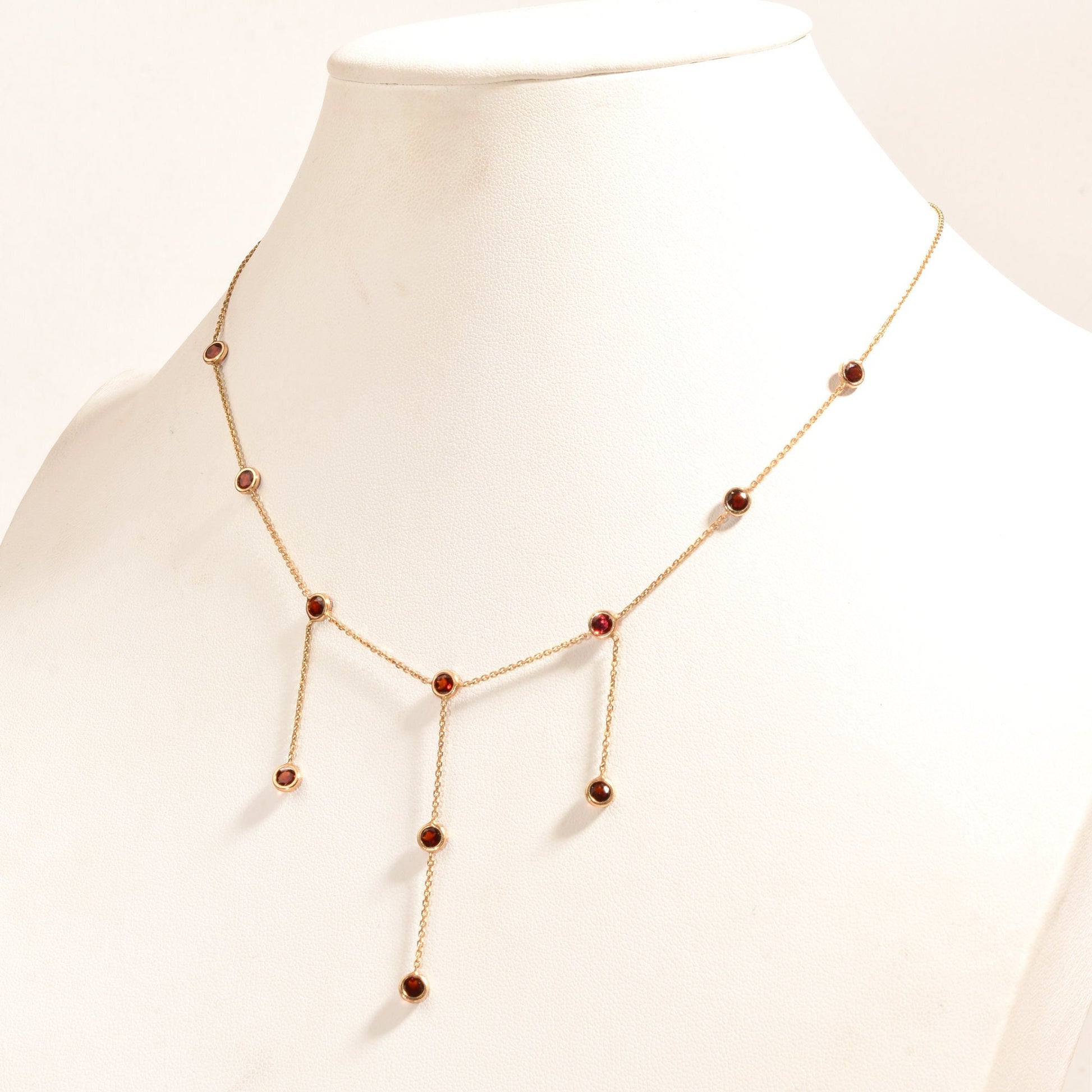 14K gold garnet station necklace with 3 tassels, minimalist bezel-set drops on delicate chain, elegant choker style, 16 inches long