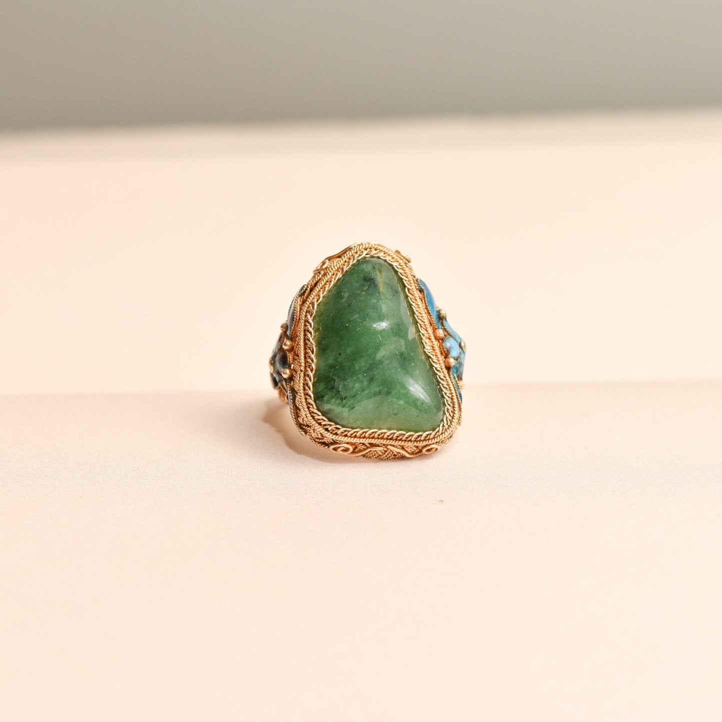 Vintage Chinese export vermeil silver adjustable ring with green jade nugget and floral enamel motifs, fits sizes 7-11 US.