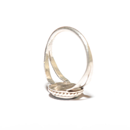 Sterling silver Little Zuni Sun Face ring, Native American jewelry, size 5.25 US, suitable for stacking, displayed against a white background.