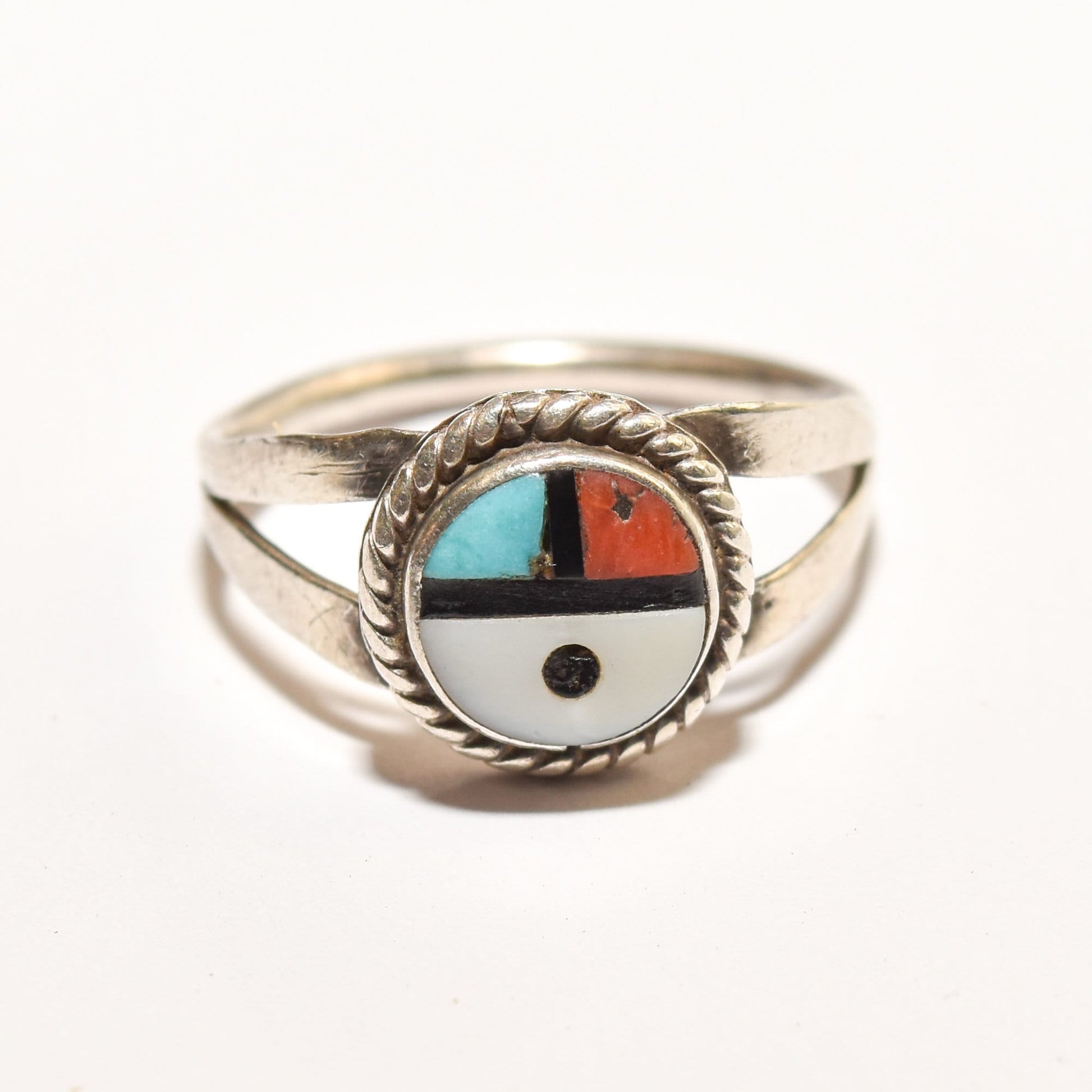 Sterling silver Little Zuni Sun Face ring with colorful inlay, Native American jewelry, size 5.25 US, on white background