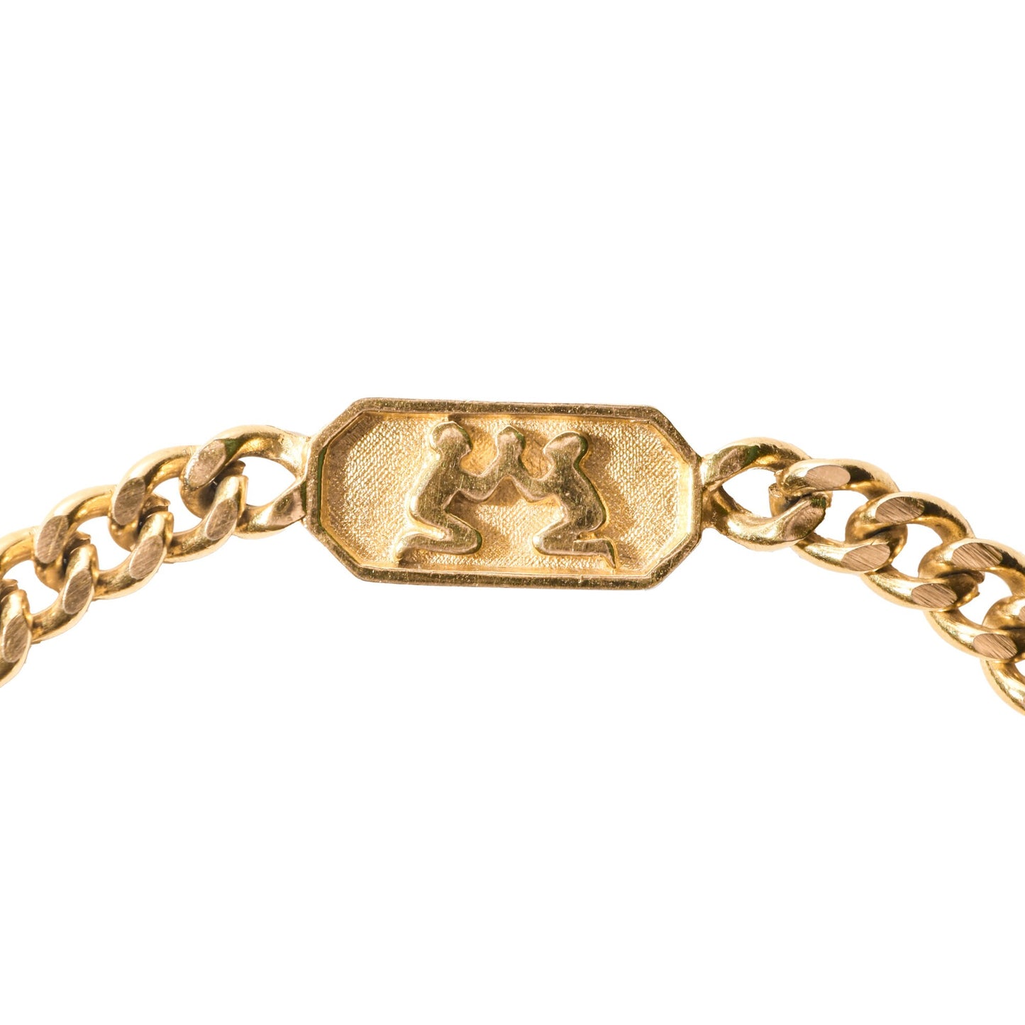 Gold-tone Trifari Gemini zodiac sign bracelet with a 5mm curb link chain, depicting astrology symbol, 7 inches in length