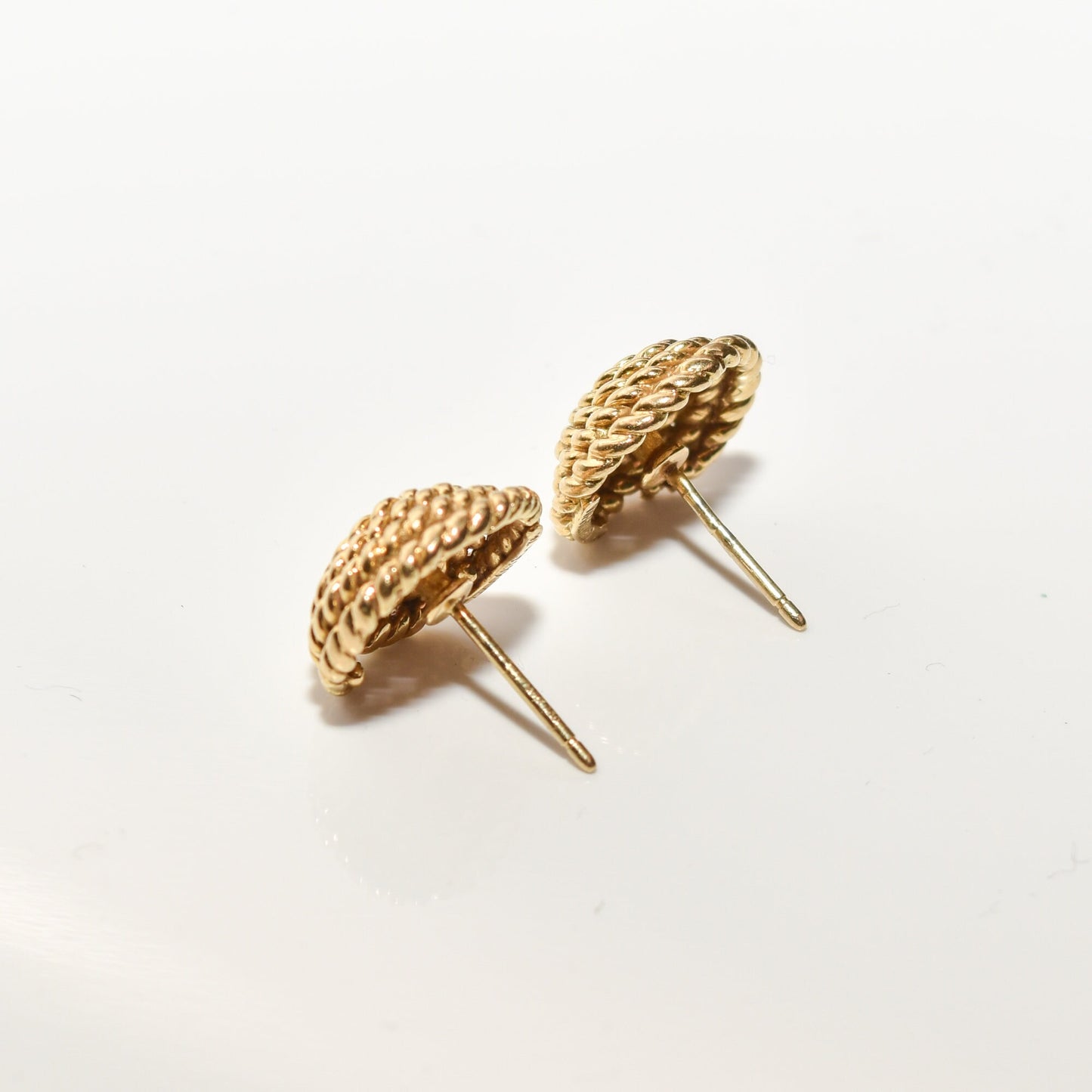 Tiffany & Co. Schlumberger 18K gold woven button stud earrings with a coiled rope design on a white background, luxury estate jewelry, 14.5mm size.