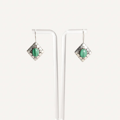 Modernist sterling silver malachite dangle earrings, cute green gemstone earrings, 1.5 inch long, displayed on white background.