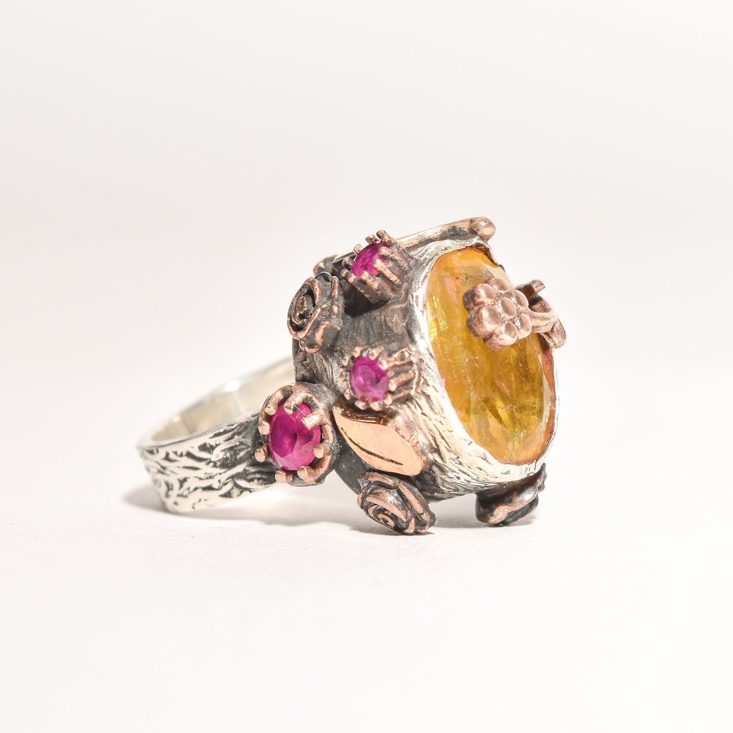 Brutalist-style sterling silver two-tone statement ring with citrine and ruby flowers, size 6.25 US, on a white background.