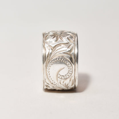 Floral engraved sterling silver band ring, Art Nouveau revival style, 11.5mm wide, size 6 US, displayed against a neutral background.