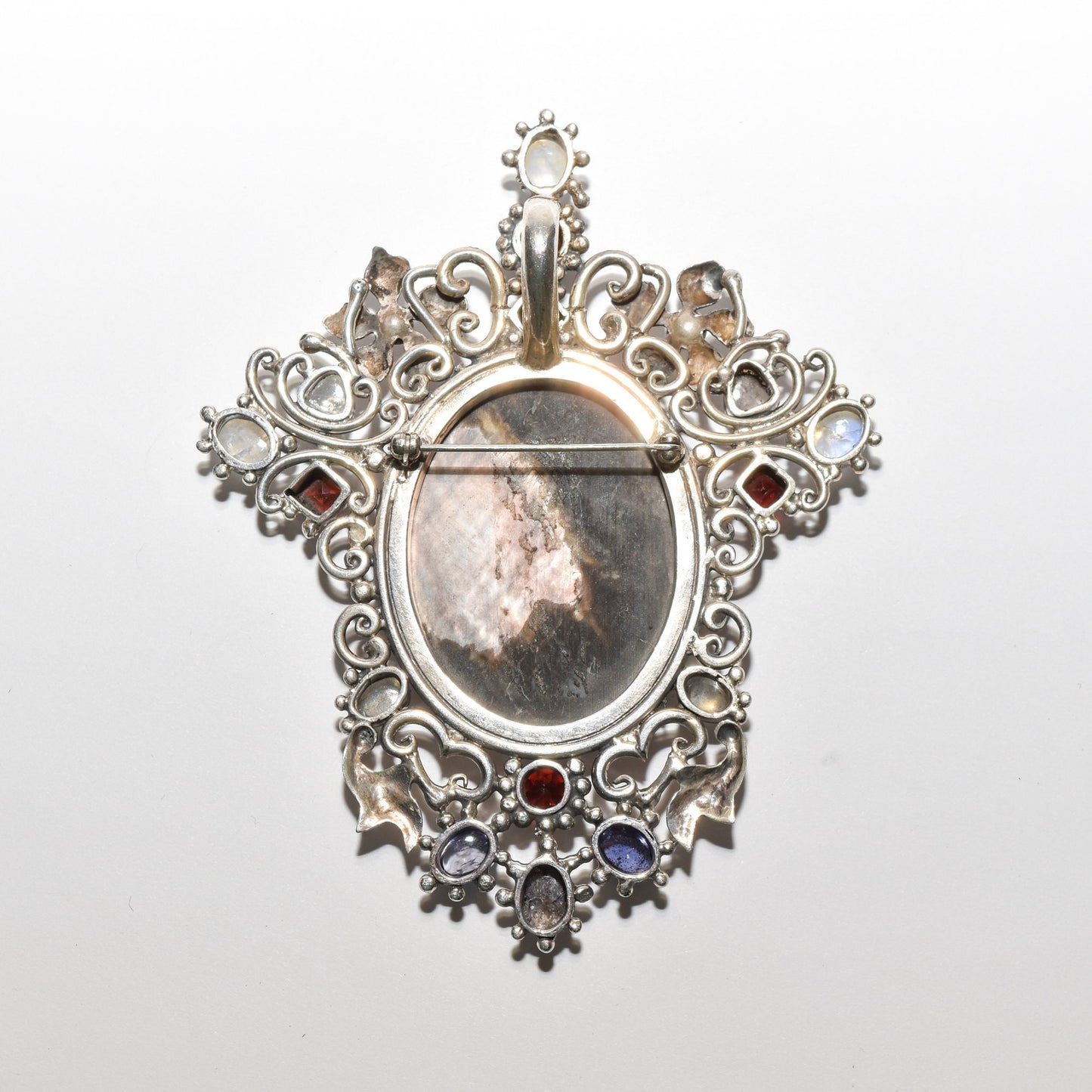 Victorian style sterling silver cameo pendant brooch with multiple gemstones and ornate design, measuring 4 inches in length.