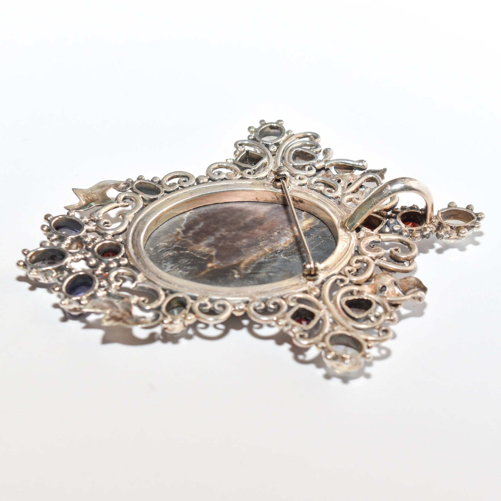 Victorian-style sterling silver cameo pendant brooch with ornate multi-stone design measuring 4 inches long.
