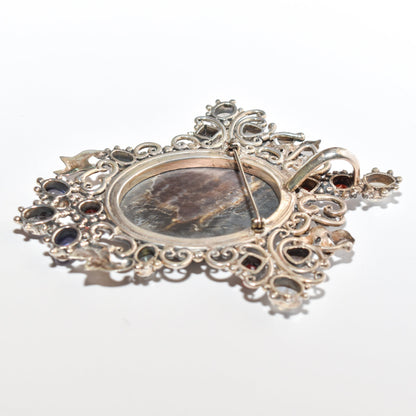 Victorian-style sterling silver cameo pendant brooch with ornate multi-stone design measuring 4 inches long.