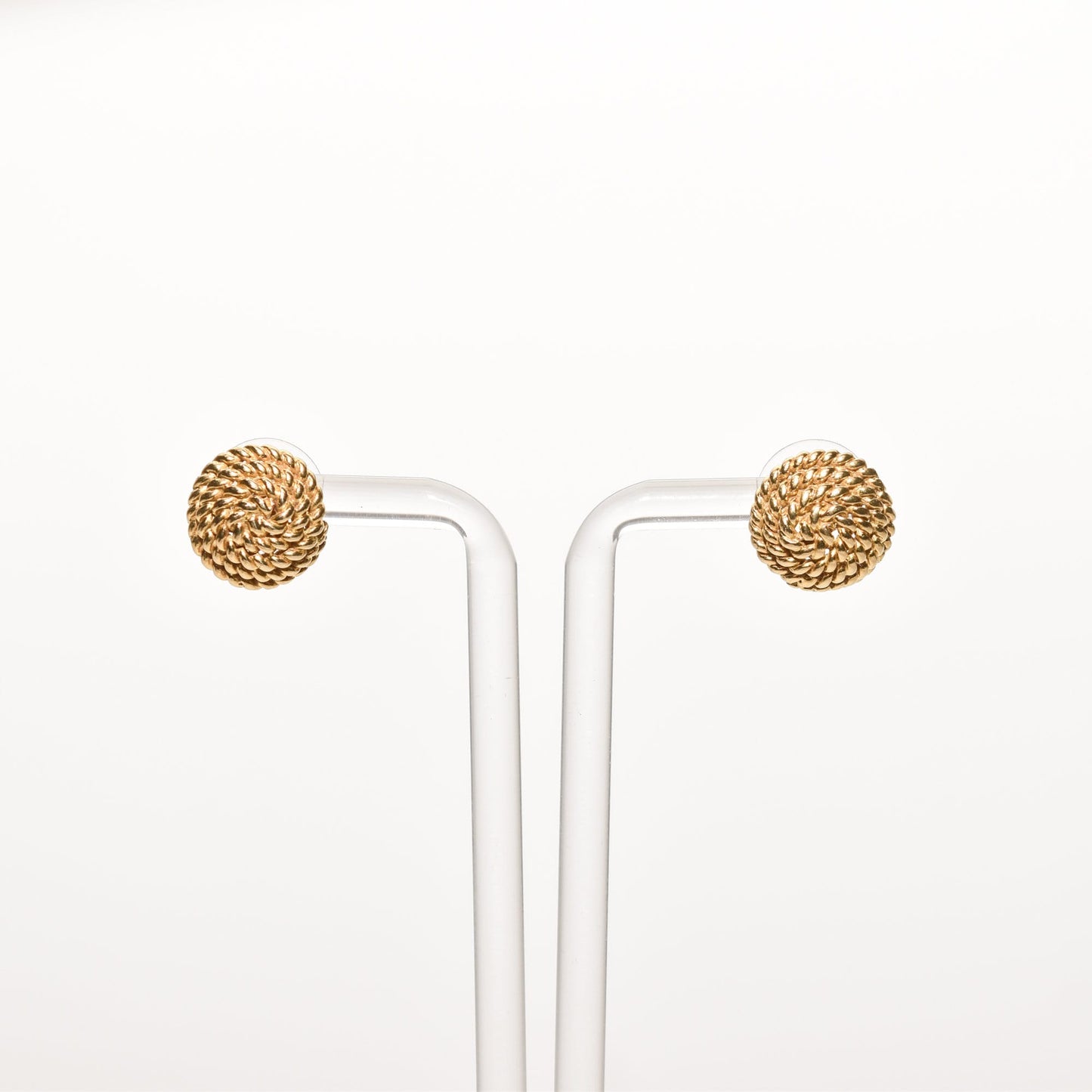 Tiffany & Co Schlumberger 18K gold woven button stud earrings on display, coiled rope design, luxury estate jewelry, 14.5mm diameter