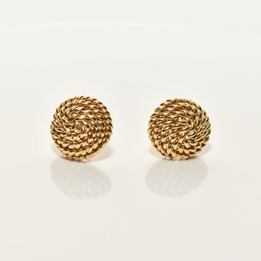 Alt text: "Tiffany & Co. Schlumberger 18K gold woven button stud earrings displayed on a reflective surface, showcasing intricate coiled rope design, typical of estate jewelry, with a 14.5mm size.