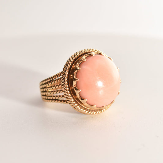 Estate Angel Skin Coral Cocktail Ring in 18K Yellow Gold with Woven Band, Size 6.25 US, displayed on a white background.