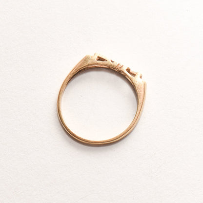 Minimalist 14K yellow gold 'LOVE' ring on a white background, cute stacking ring, perfect for Valentine's Day gift, size 6.75 US