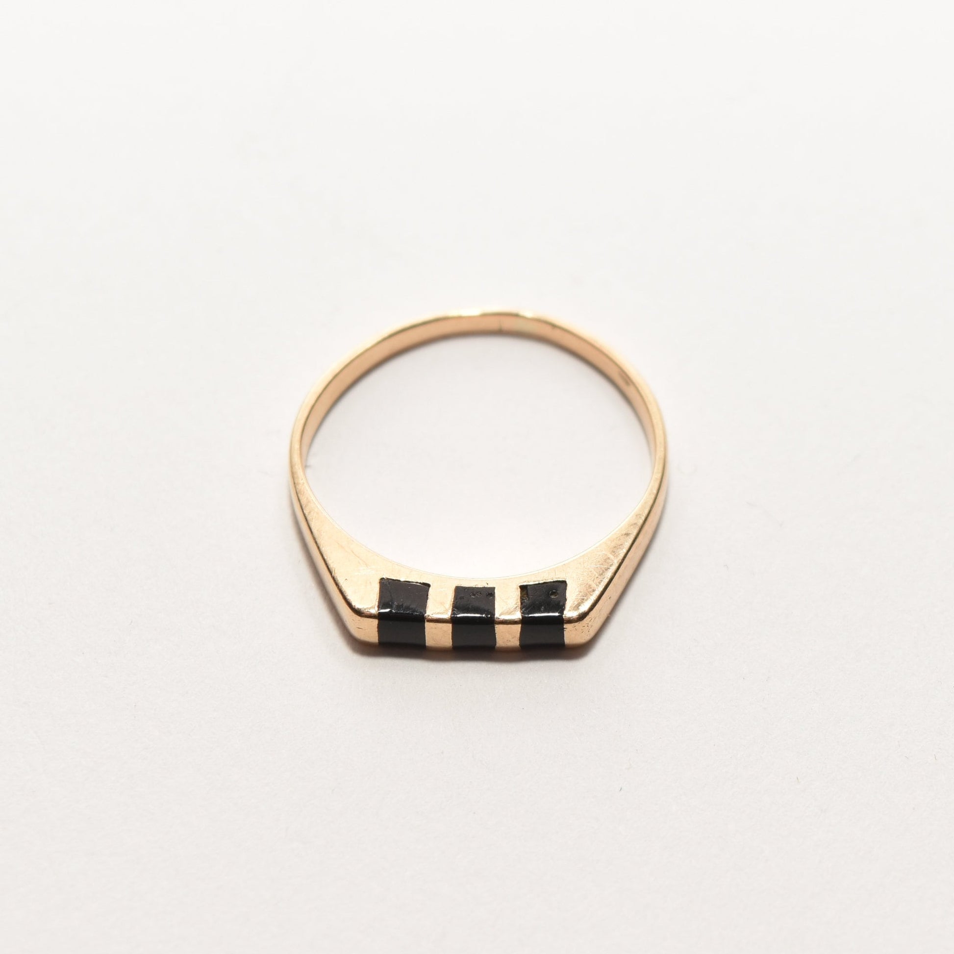 Minimalist 14K gold stacking ring with black onyx inlay, size 5.5, displayed on white background.