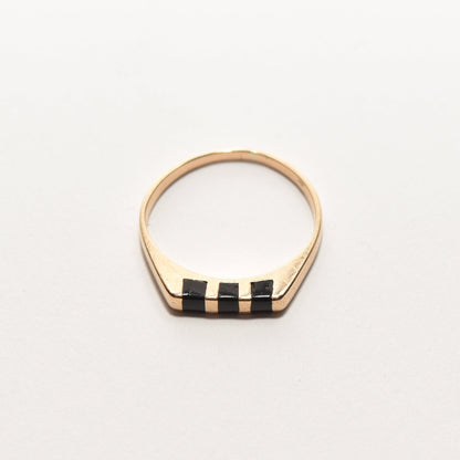 Minimalist 14K gold stacking ring with black onyx inlay, size 5.5, displayed on white background.