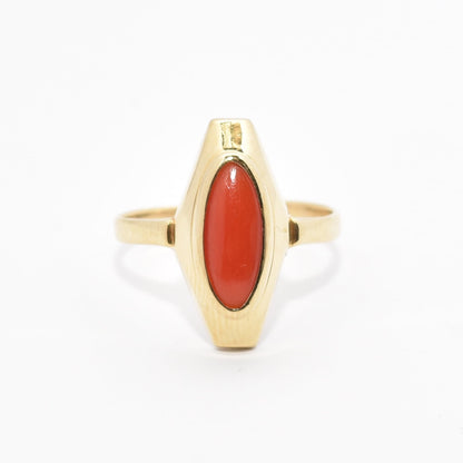 Estate 18K yellow gold ring with marquise-cut red coral centerpiece, size 5.25 US, on a white background.