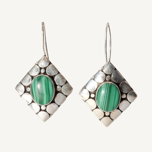 Modernist sterling silver dangle earrings with malachite gemstones, cute 1.5-inch length, on white background.