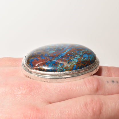 Huge sterling silver cabochon statement ring with chunky blue matrix gemstone, size 7 3/4 US, showcased on a finger