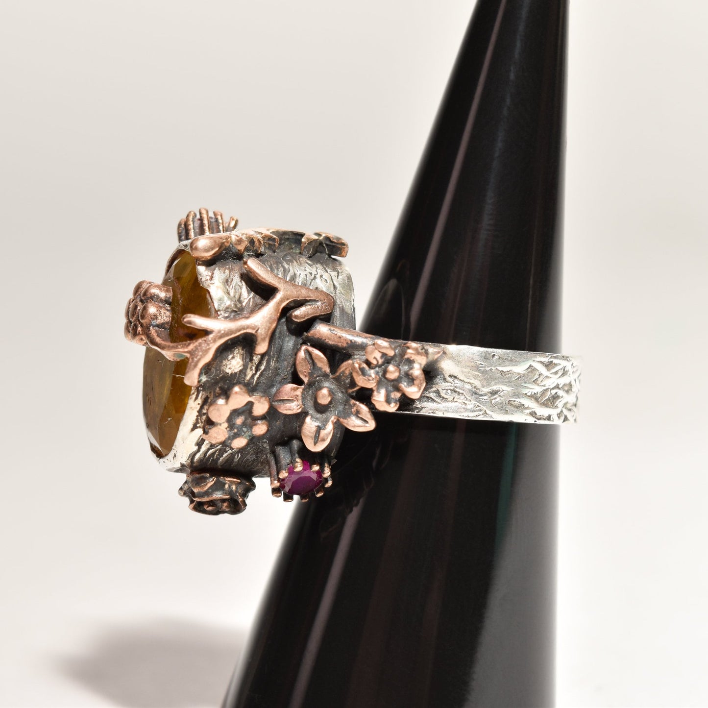 Brutalist sterling silver citrine ruby flower ring on display, two-tone statement piece size 6.25 US, showcasing intricate metalwork and gemstones.